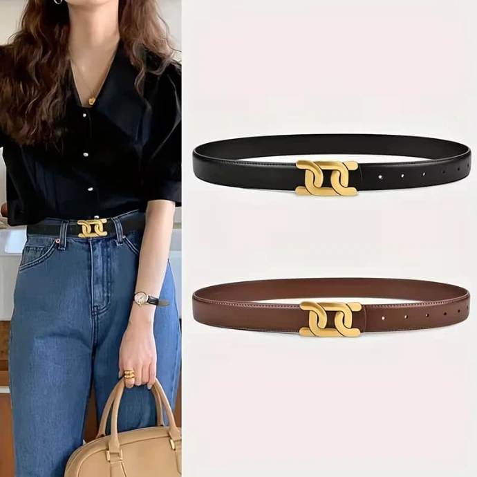 A stylish woman wearing blue jeans and a black blouse, cinched with a leather belt featuring a chic gold-tone interlocking buckle; beside her are the same belts in black and brown.